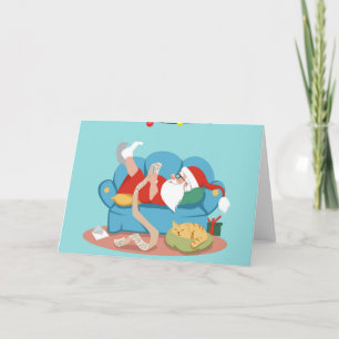 Santa Claus on the couch in pyjamas Card