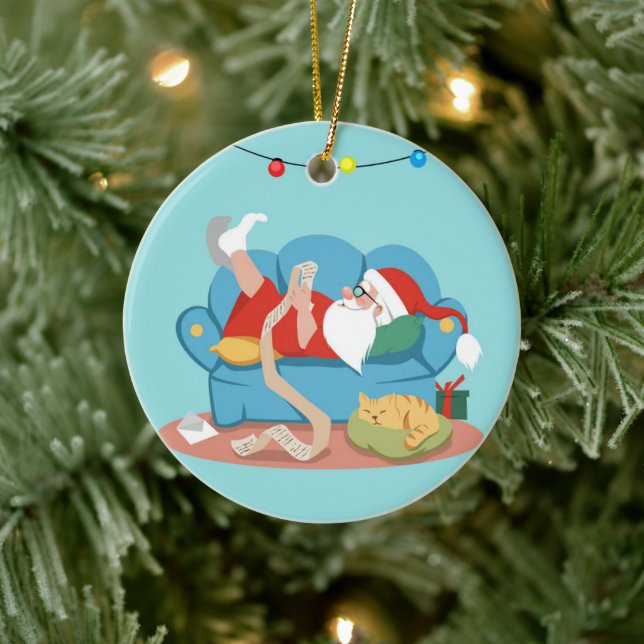 Santa Claus on the couch in pyjamas Ceramic Ornament (Tree)