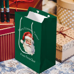 Santa Claus Personalized Green Kids Christmas Medium Gift Bag<br><div class="desc">Customize this nostalgic from Santa Claus green gift bag with your own personalized text with your kids name in white script. This beautiful old fashioned drawing of Santa's red hat and white beard are the perfect holiday present bags for your children's presents under the tree on Christmas day.</div>