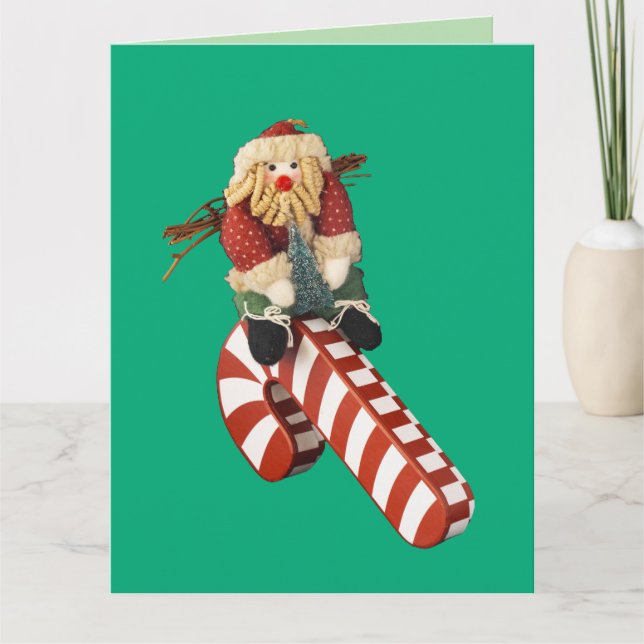 Santa Claus plays on candy cane slide for fun. Card (Front)