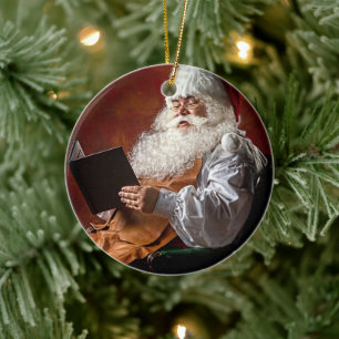 Santa Claus reads book Ceramic Ornament