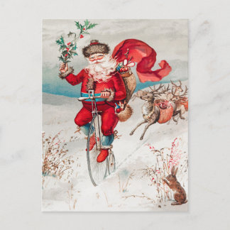 Santa Claus Riding Bicycle, Reindeer and Rabbit Holiday Postcard
