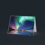 Santa Claus & the Northern Lights Holiday Card<br><div class="desc">Santa Claus at the North Pole,  waving while flying off with his reindeer into the beautiful Northern Lights. The Aurora Borealis is reflecting into the lake water with the bright colourful colours.</div>