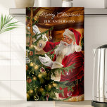 Santa Decorating Christmas Tree Personalized Kitchen Towel<br><div class="desc">Celebrate the magic of Christmas with this personalized kitchen towel featuring Santa Claus trimming the Christmas tree. With warm holiday colours and intricate details, this towel adds festive charm to your kitchen decor. Personalize it with your family name to make it a cherished holiday keepsake that brings warmth and nostalgia...</div>