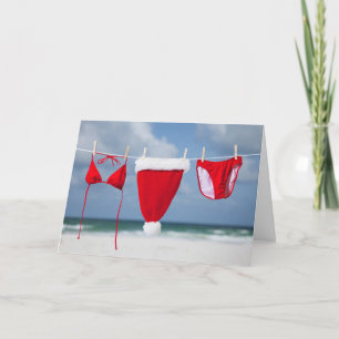 Santa hat and bikini on a clothesline holiday card