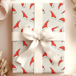 Santa Hats Christmas Patterned Wrapping Paper<br><div class="desc">This charming Christmas wrapping paper showcases a fun pattern of Santa hats, perfect for bringing festive cheer to your gifts. The bright red and white hats stand out against the backdrop, making it a delightful choice for wrapping presents during the holiday season. Ideal for spreading Christmas joy with a classic...</div>