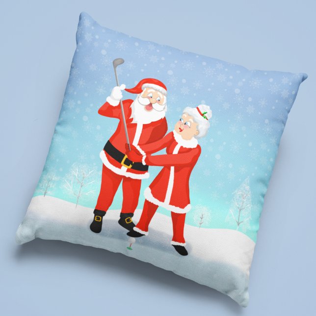 Santa Helping Mrs. Claus With Her Golf Swing Throw Pillow (For the golfing family or a couple, this is a great winter addition to your home decorations.)