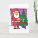 Santa Lighting a Menorah Holiday Card<br><div class="desc">Interfaith greeting card featuring Santa Lighting a Hanukkah Menorah in front of Christmas Tree.</div>