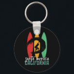 Santa Monica Beach California Retro Surfing Keychain<br><div class="desc">Vintage retro surfboard design for surfers who love surfing and riding the ocean waves. Cool summer holiday, spring break merchandise for those who enjoy hot sun, tropical weather, sunbathing under the palm tree. Grunge and distressed design to wear while enjoying the beach party and singing around the bonfire. Great souvenir,...</div>