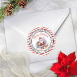 Santa | Reindeer Christmas Circle Return Address Classic Round Sticker<br><div class="desc">Cute watercolor santa and reindeer "Merry Christmas" circular return address envelope or package seal.  Design features a red and white diagonal-striped background on the outside rims of the circle as a backdrop to snowfall. Simply personalize with your greeting,  name or family name and return address,  city,  state and zip.</div>