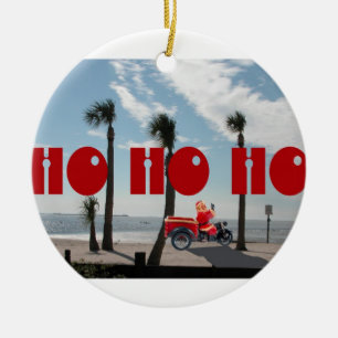 Santa Rides a Motorcycle on the Beach Ceramic Ornament