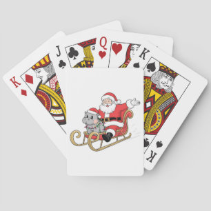 Santa Riding Sleigh with a Moo Deng Baby Hippo Playing Cards