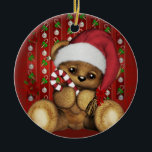 Santa Teddy Bear with Candy Cane Ceramic Ornament<br><div class="desc">An adorable teddy bear wearing a Santa hat and holding a candy cane. The red background also has candy canes,  decorations and some festive Poinsettia flowers.</div>