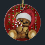 Santa Teddy Bear with Candy Cane Ceramic Ornament<br><div class="desc">An adorable teddy bear wearing a Santa hat and holding a candy cane. The red background also has candy canes,  decorations and some festive Poinsettia flowers.</div>