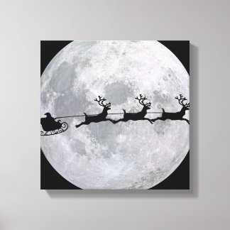 Santa's Sleigh In Front Of Moon Canvas Print