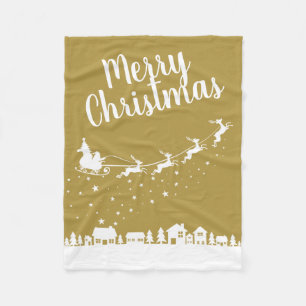 Santa's sleigh silhouette flying above the houses fleece blanket