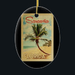 Sarasota Palm Tree Vintage Travel Ceramic Ornament<br><div class="desc">A uniquely retro mid-century modern Sarasota Florida art print in vintage travel poster style. It features a curved palm tree on sandy beach with ocean under a blue cloudy sky.</div>