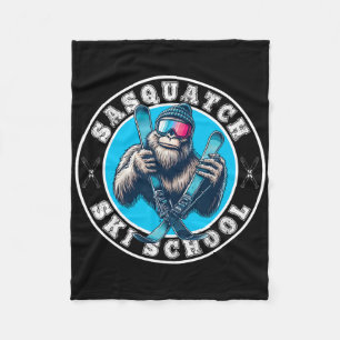 Sasquatch Ski School Funny Bigfoot Skiing Fleece Blanket