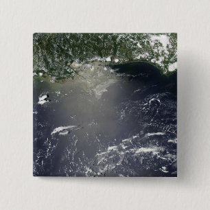 Satellite view of oil leaking 2 inch square button