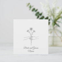 Mariage minimaliste aux mains tenant des fleurs de