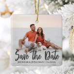 Save the Date Romantic Couple Photo Christmas Ceramic Ornament<br><div class="desc">Save the New Date written in chic bold grey typography on this romantic engagement photo Christmas ornament. Add your own full bleed couple photograph on this unique minimalist Save the Date gift and personalize the wedding details over the photograph. This modern wedding invite idea features a 2nd picture on the...</div>