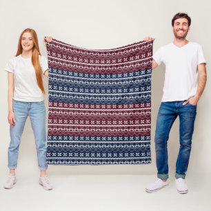 Scandinavian ornament on a blue, burgundy  fleece blanket