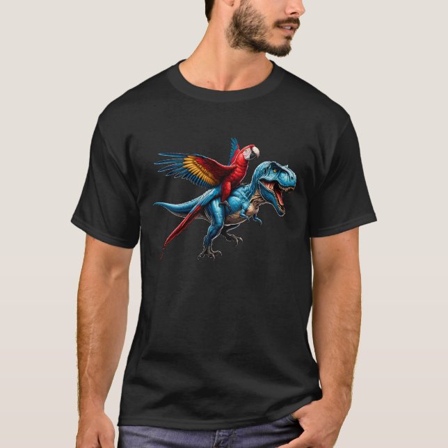 Scarlet Macaw Parrot Riding Dinosaur Funny Bird T-Shirt (Front)