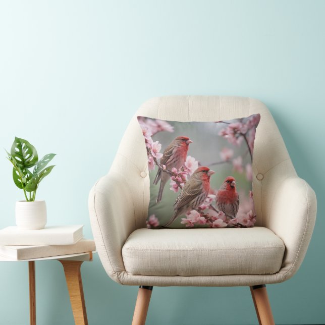 "Scarlet Trio: Red Finches Among Pink Blossoms" Throw Pillow (Chair)