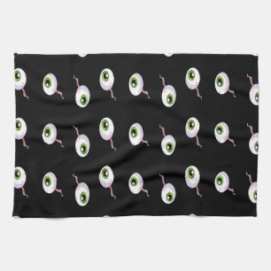Scary eyeballs on black kitchen towel