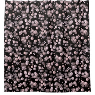 Scatterings of pink and white pearls on black velv