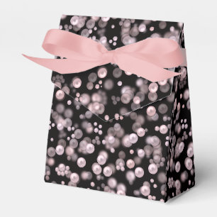 Scatterings of pink and white pearls on black velv favor box