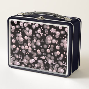 Scatterings of pink and white pearls on black velv metal lunch box