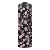 Scatterings of pink and white pearls on black velv