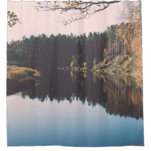 Scenic autumn coloured river in country with trees