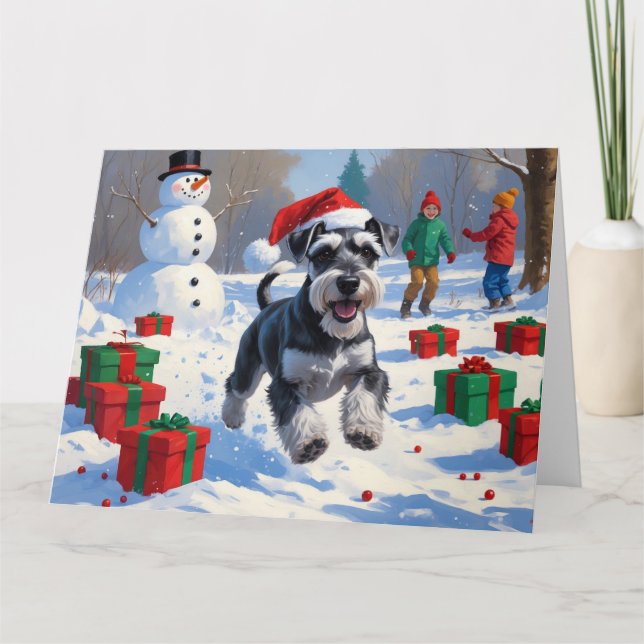 Schnauzer Running in Snow with Christmas Hat Card (Front)