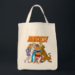 Scooby-Doo and the Gang Investigate Book Tote Bag<br><div class="desc">Check out Velma reading a clue in a book,  surrounded by Daphne,  Fred,  Shaggy,  and Scooby-Doo!</div>