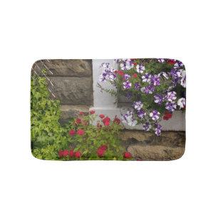 Scottish cottage window with petunias and roses bath mat