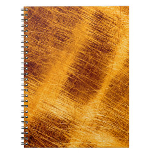Scratches on a metallic gold background. abstract, notebook