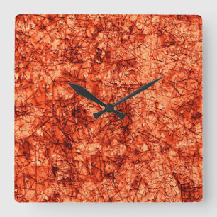 Scratches on scratches on a lightly spotted coral square wall clock