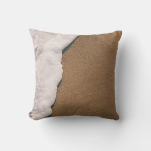 Sea foam on sand throw pillow