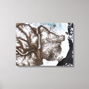 Sea ice lines the shoreline in eastern Greenlan Canvas Print
