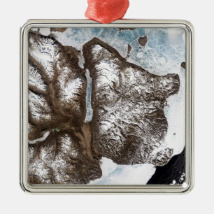 Sea ice lines the shoreline in eastern Greenlan Metal Ornament