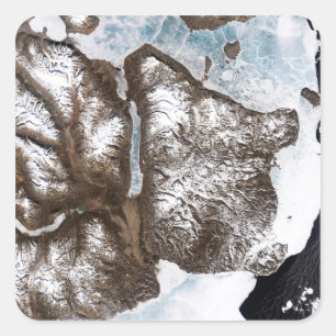 Sea ice lines the shoreline in eastern Greenlan Square Sticker