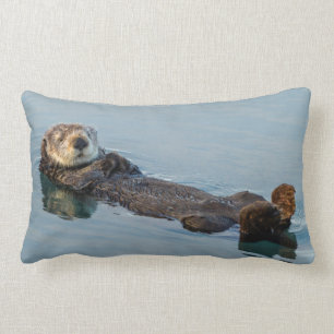 Sea otter floating on back in ocean lumbar pillow