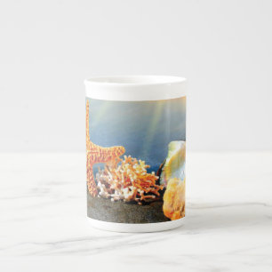 Sea shells and starfish on beach bone china mug
