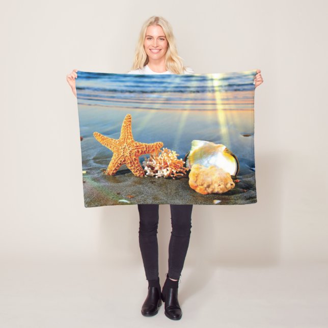 Sea shells and starfish on beach fleece blanket (In Situ)