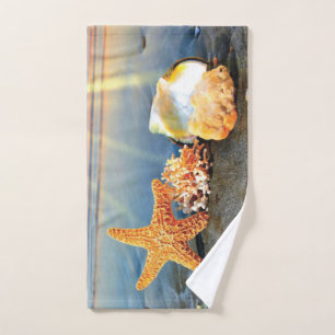 Sea shells and starfish on beach hand towel