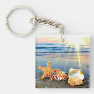 Sea shells and starfish on beach keychain