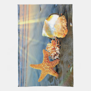 Sea shells and starfish on beach kitchen towel