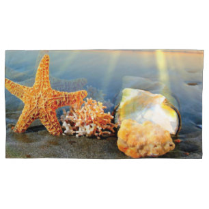 Sea shells and starfish on beach pillowcase
